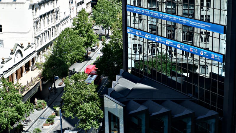 NZX50 largely flat as investors turn to earnings, RBNZ post image